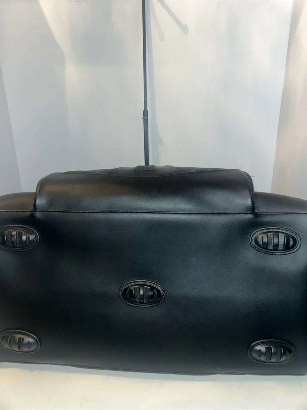 Tumi Black Duffel Bag with Red Logo Accent
